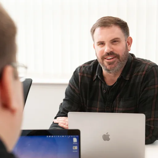 Edward Newman and Nathan Barnett in a team meeting
